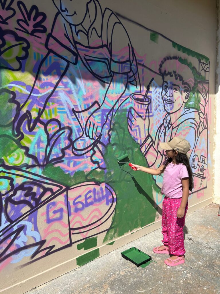 Entre arte, cor e ideias, parede ganha vida no Ginásio Flávio Derzi, em Amambai